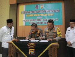 Bupati Tanjabbar Saksikan Penandatanganan NPHD Antara Polres dan Sat Pol-PP Tanjabbar